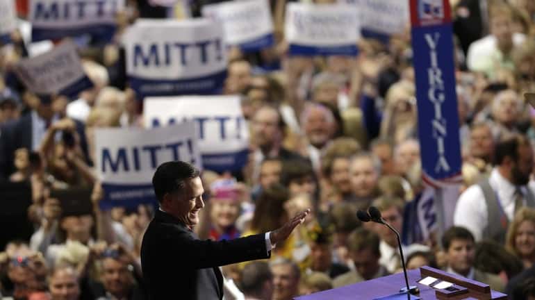 Republican presidential nominee Mitt Romney acknowledges delegates before speaking at...
