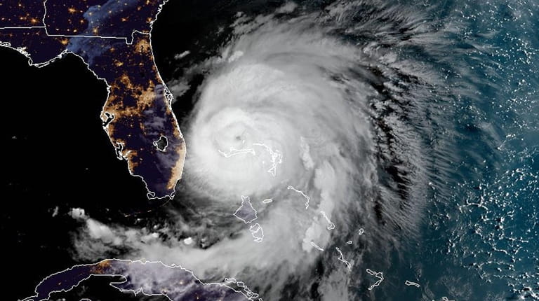 Hurricane Dorian sits over the Bahamas early on Tuesday.