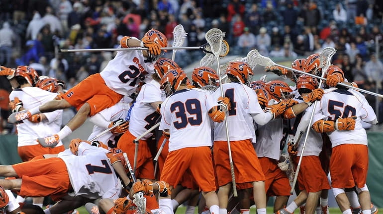 The Syracuse lacrosse team celebrates their 9-8 win over Denver....