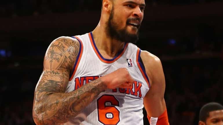 Tyson Chandler celebrates after a dunk during a game against...