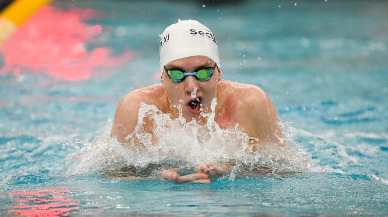 Westhampton's Max Buchen competes in the boys 100-yard breaststroke at the...