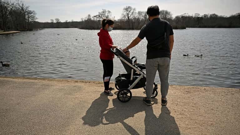 Dylan and Cherlyn Chung of Islip, strolled with their son...