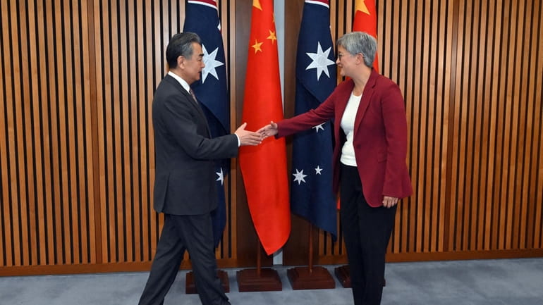 China's Foreign Minister Wang Yi, left, meets with Australia's Minister...