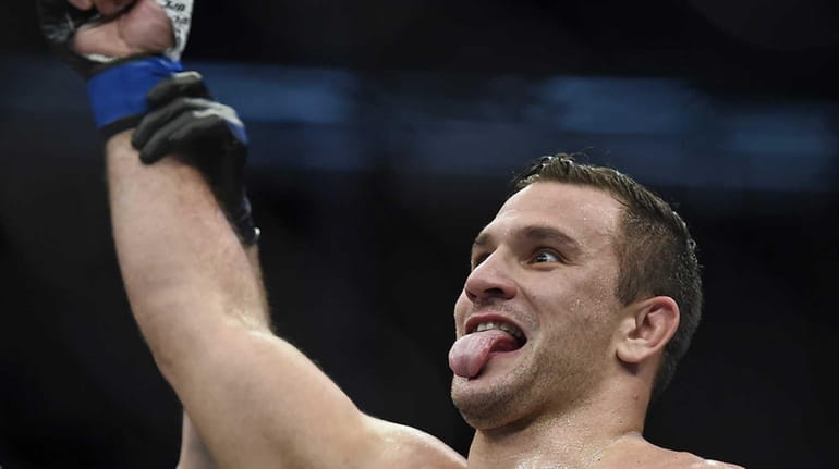 Gian Villante celebrates after defeating Anthony Perosh during their UFC...