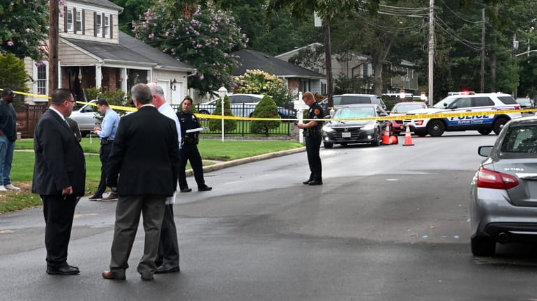 Suffolk County police investigate a shooting on Glenmalure Street near Columba...