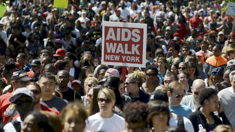 Participants march in the 29th Annual AIDS Walk New York...