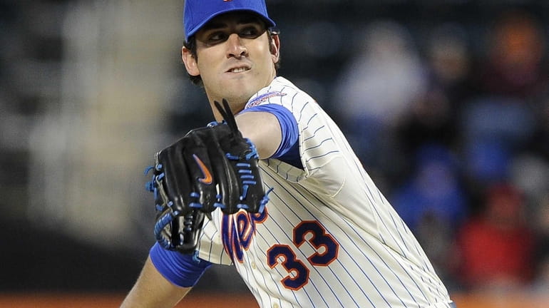 Matt Harvey delivers a pitch in the first inning of...