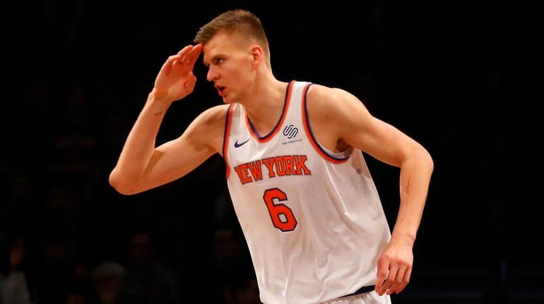 Knicks forward Kristaps Porzingis reacts after a basket in the...