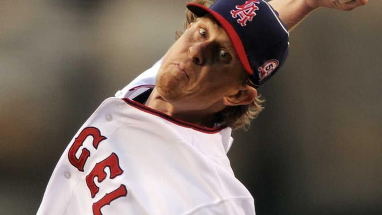 Los Angeles Angels starting pitcher Jered Weaver throws to the...