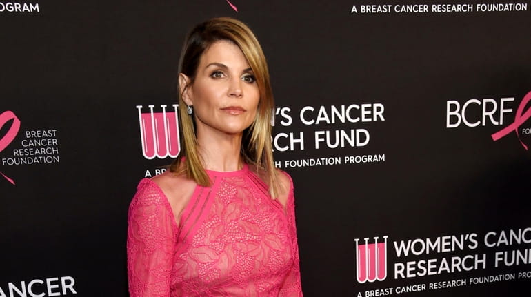Lori Loughlin poses at the 2019 "An Unforgettable Evening" benefiting...