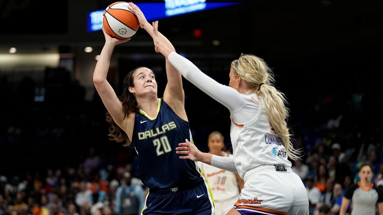 Dallas Wings forward Maddy Siegrist (20) looks to shoot against...