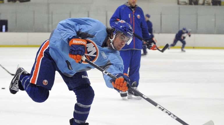 Michael Grabner shoots during the New York Islanders training camp....