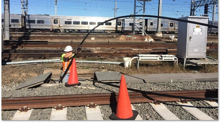 LIRR installs the inner duct of a conduit that will...