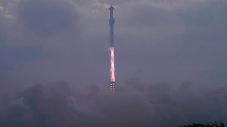 SpaceX's mega rocket Starship launches at dawn in the haze...