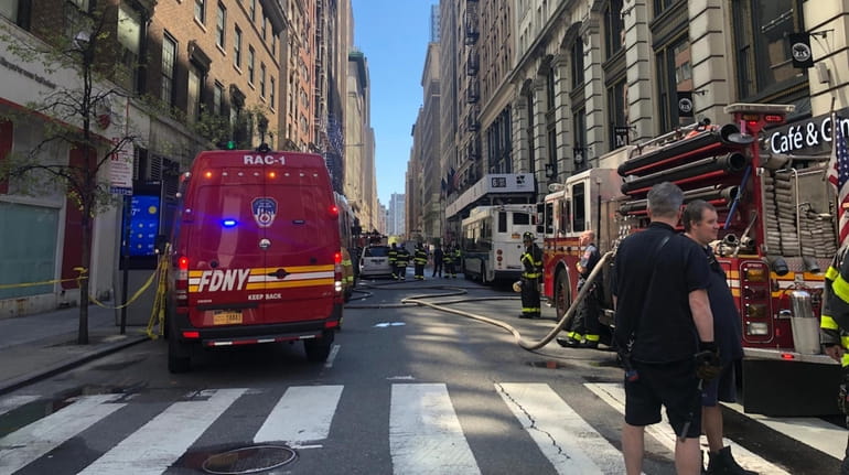 Manhole explosions in midtown Manhattan on Wednesday injured four people...