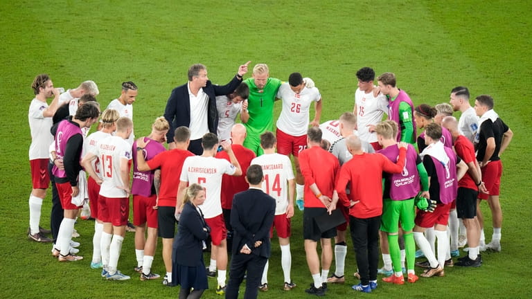 Denmark's head coach Kasper Hjulmand talks to Denmark players at...
