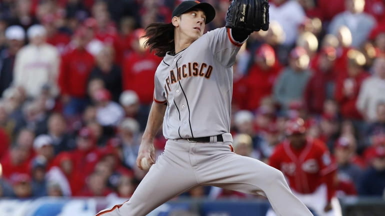 San Francisco Giants pitcher Tim Lincecum delivers a pitch during...