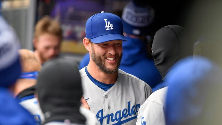 Los Angeles Dodgers pitcher Clayton Kershaw celebrates with teammates after...