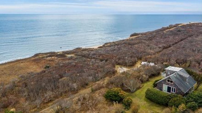 This Montauk cottage has a second-floor bedroom with a balcony...