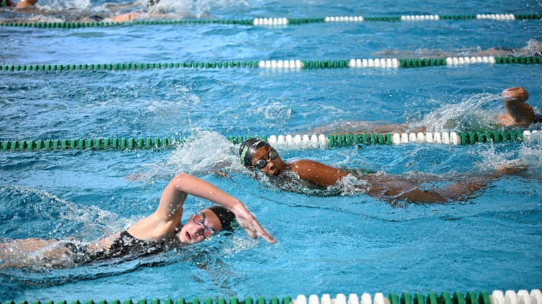 Members of the Lady Dalers Swim and Dive Team practice...