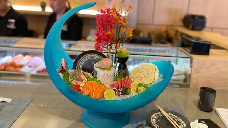 The Carnival sushi boat at Honami Sushi Hibachi & Lounge,...