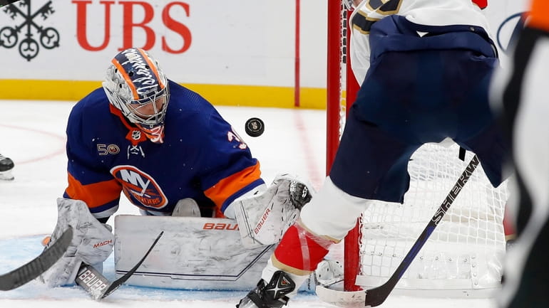 Ilya Sorokin #30 of the New York Islanders makes a...