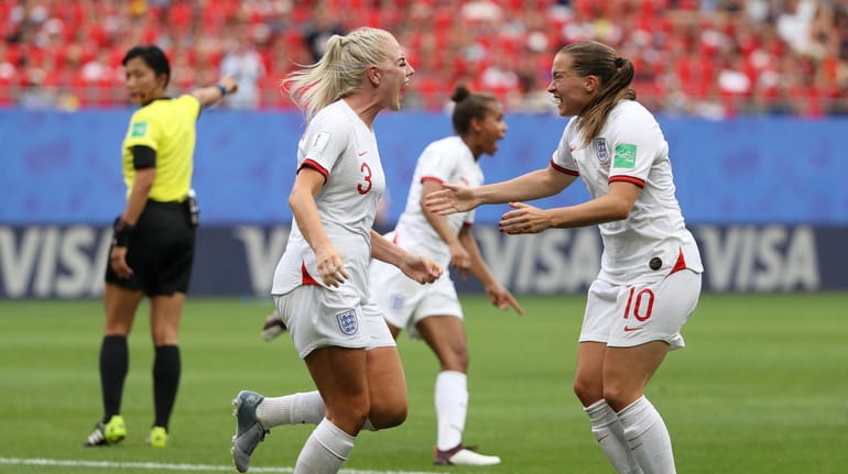 Alex Greenwood of England celebrates with teammate Fran Kirby after...