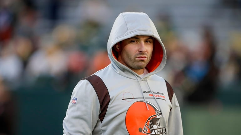 FILE - Cleveland Browns' Baker Mayfield warms up before an...