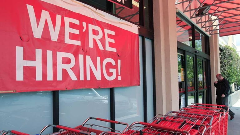 A "We're Hiring!" sign beckons at Office Depot in Mountain...