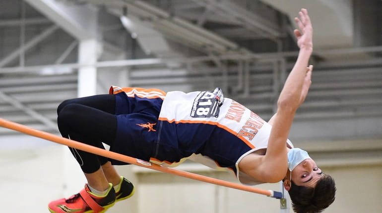 Adam Namdar of Great Neck North clears the bar at...