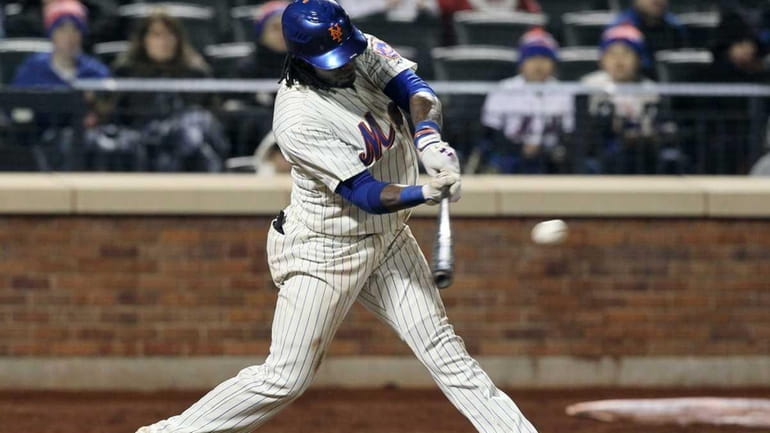 The Mets' Jose Reyes connects on a ninth-inning two-run double...