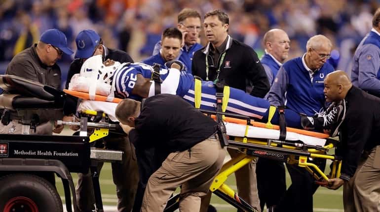 Colts tight end Brandon Williams is taken off the field...