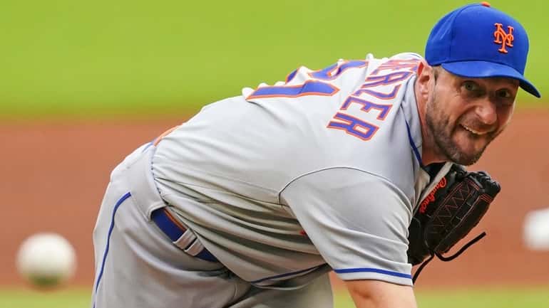 Mets starting pitcher Max Scherzer works the first inning of...