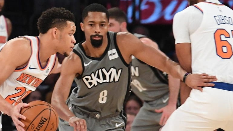 Nets guard Spencer Dinwiddie defends Knicks guard Kevin Knox at Madison...