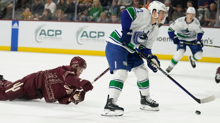 Vancouver Canucks' Anthony Beauvillier (72) looks to shoot in front...