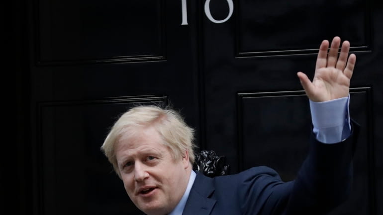 Britain's Prime Minister Boris Johnson returns to 10 Downing Street...