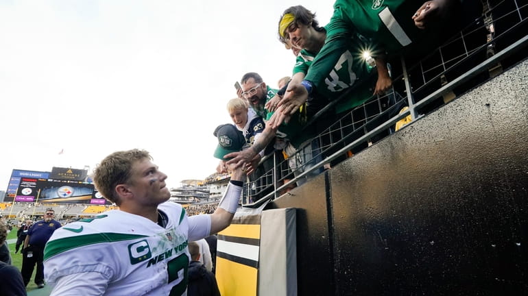 Jets quarterback Zach Wilson (2) greets fans as he heads...