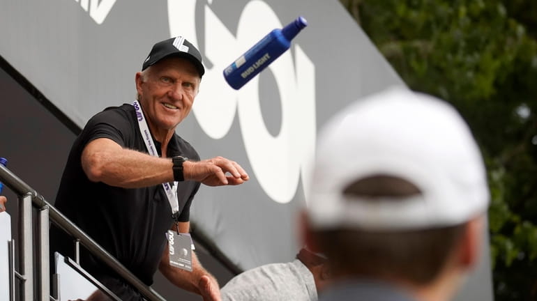LIV Golf CEO Greg Norman tosses beer to fans on...