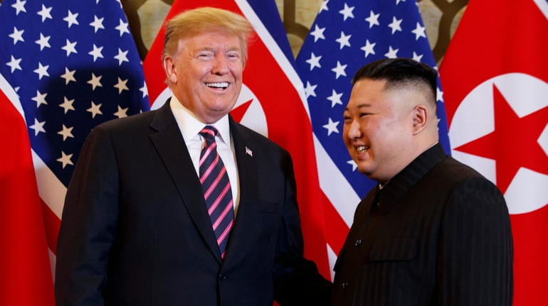 President Donald Trump, left, meets North Korean leader Kim Jong...