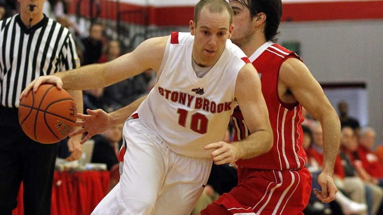 Stony Brook's Bryan Dougher drives around Hartford's Andres Torres in...
