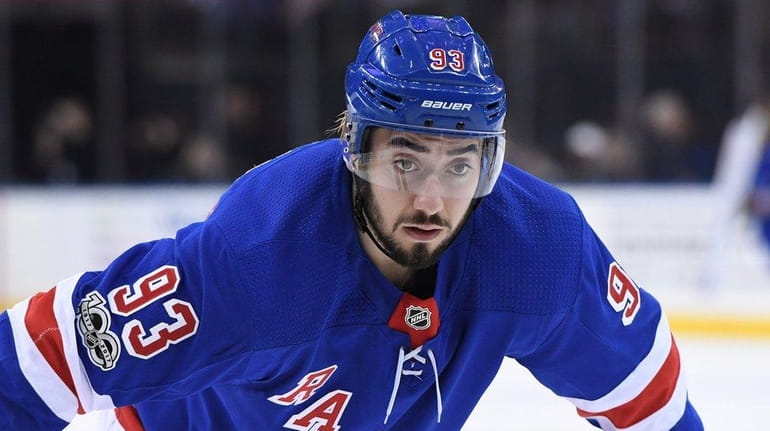 New York Rangers center Mika Zibanejad sets for a face-off...