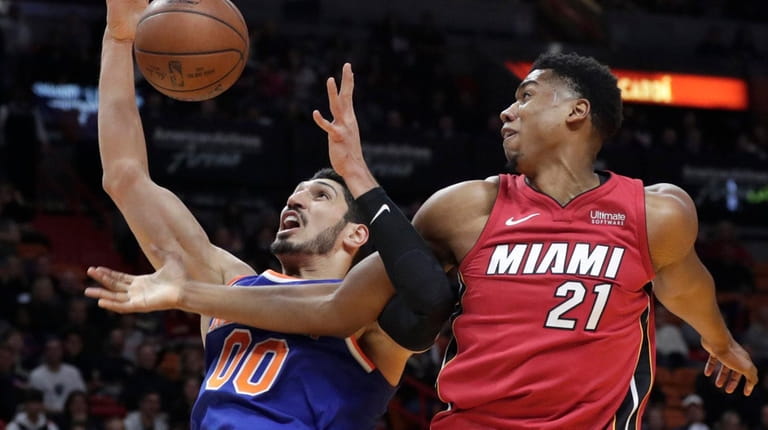The Heat's Hassan Whiteside blocks a shot by the Knicks'...