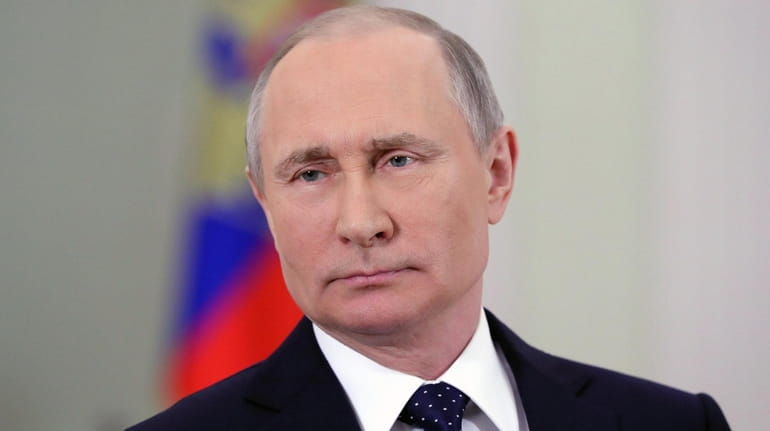 President Vladimir Putin addresses the nation in the Kremlin in...