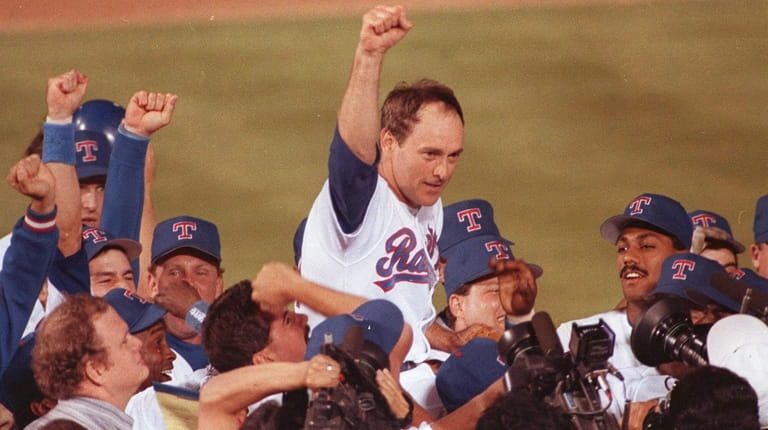 Texas Rangers pitcher Nolan Ryan is carried off the field...