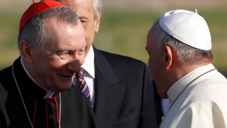 Pope Francis greets Vatican Secretary of State Monsignor Pietro Parolin,...