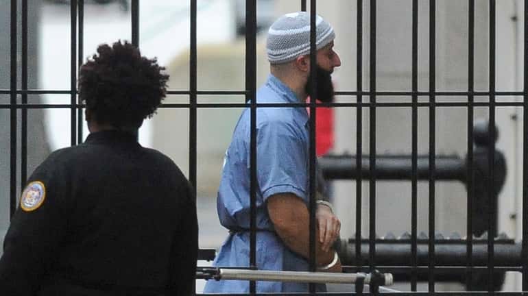 Adnan Syed enters Courthouse East prior to a hearing on...