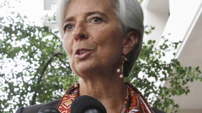 French Finance Minister Christine Lagarde speaks to the media outside...