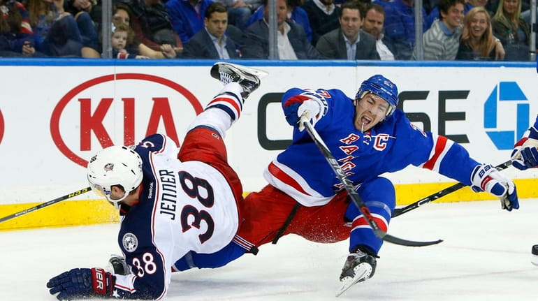 Ryan McDonagh #27 of the New York Rangers defends against...