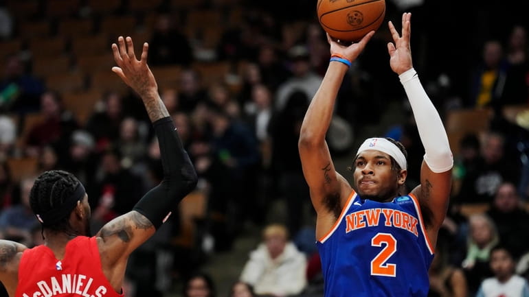 Knicks guard Miles McBride shoots over Toronto Raptors forward Jalen...