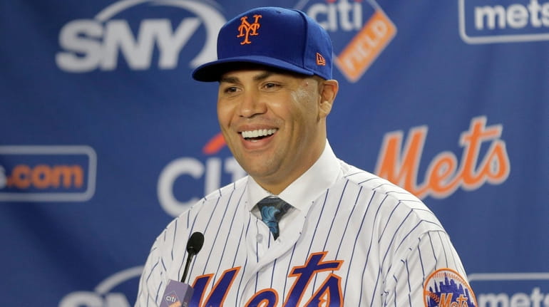 Mets manager Carlos Beltran smiles during an introductory news conference...